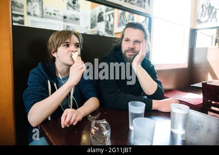 USA, California, San Francisco, Father and son at cafe table Stock Photo