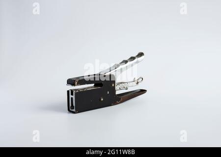 vintage hand stapler on a white background Stock Photo