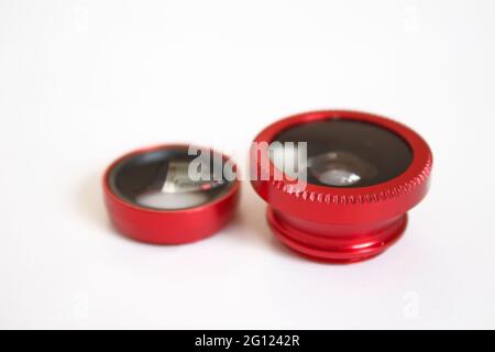 Smartphone lenses, various phone lenses on isolated white background, mobile photography tools Stock Photo