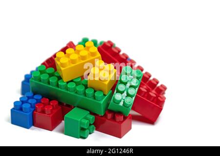 Colorful plastic building blocks against a white background Stock Photo