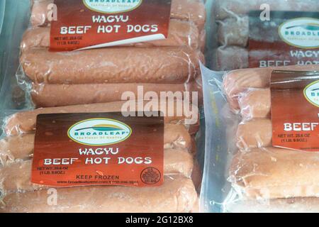 Florida Naples Jimmy P's Butcher Shop & Deli Charred Steakhouse restaurant dining market refrigerated display sale case wagyu beef hot dogs Stock Photo