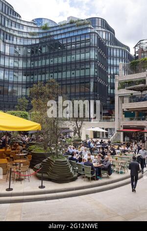 City of London lifestyle, workers eating and drinking in the early evening after work in restaurants and bars, Broadgate Circle London city centre UK Stock Photo