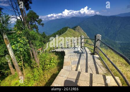 Stair case from foreground to middleground in the frame, view of Tarey Bhir point, favourite tourist spot. The word 'Bhir' means cliff in the local Ne Stock Photo