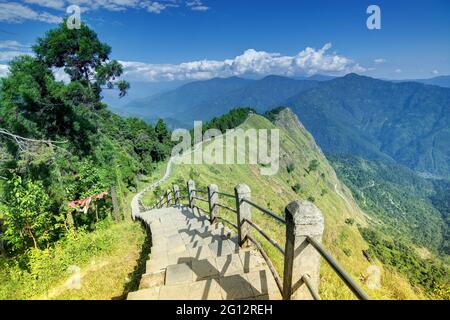 Stair case from foreground to middleground in the frame, view of Tarey Bhir point, favourite tourist spot. The word 'Bhir' means cliff in the local Ne Stock Photo