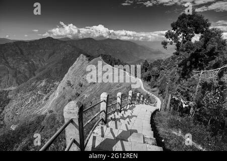 Stair case from foreground to middleground in the frame, view of Tarey Bhir point, favourite tourist spot. The word 'Bhir' means cliff in the local Ne Stock Photo