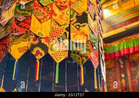 Buddhist thangka - a Tibetan Buddhist painting on cotton, or silk applique - in a monastery in Ralong, Sikkim, India Stock Photo