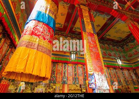 Buddhist thangka - a Tibetan Buddhist painting on cotton, or silk applique - in a monastery in Ralong, Sikkim, India Stock Photo