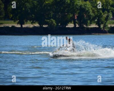 NOVI SAD, SERBIA - Sep 08, 2013: Novi Sad, Serbia, September 8th 2013. - Action shot of young man on jet ski watersport Stock Photo