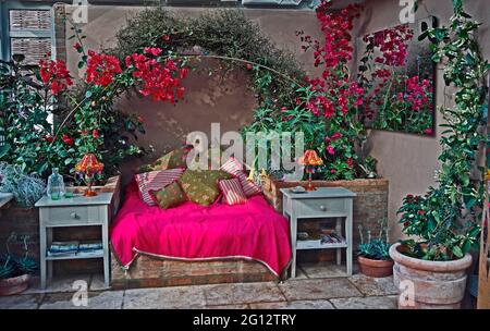 An exotic and colourful furnished conservatory with colourful Bourgainvillea Stock Photo