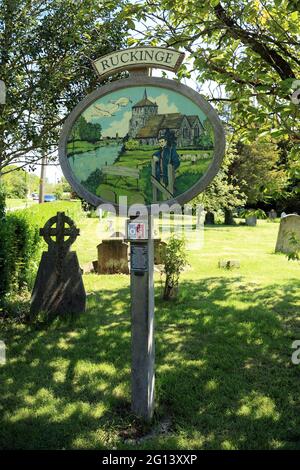 Village Millennium sign in churchyard of the church of St Mary Magdalen, Hamstreet Road, Ruckinge, Ashford, Kent, England, United Kingdom Stock Photo