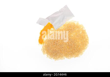 Macaroni & Cheese package mix on white showing elbow pasta and packet of cheese mix Stock Photo