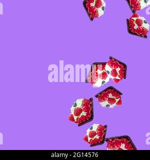 cakes fall from top to bottom on the blue-purple background on the right.  Stock Photo