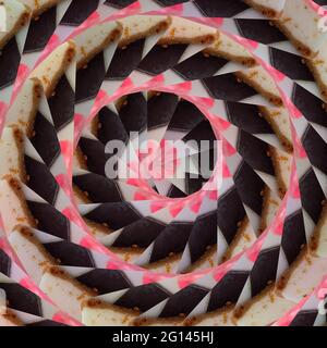 spiral vortex of a sweet cake in a brown-pink-white color.Spiral background. Stock Photo