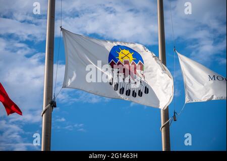 Treat 7 Flag in Alberta at half mast, blue sky background. Stock Photo