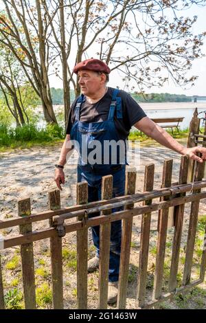 portrait of mature blacksmith. Worker relaxing in his workshop in the countryside Stock Photo