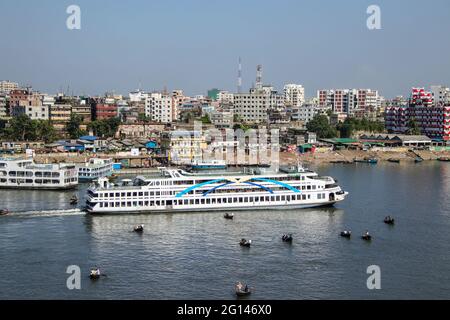 Buriganga river, Dhaka, Bangladesh : The Buriganga river is always busy with wooden boats and passenger ferries Stock Photo