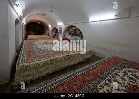 Stack of Persian carpets in Isfahan, Iran Stock Photo