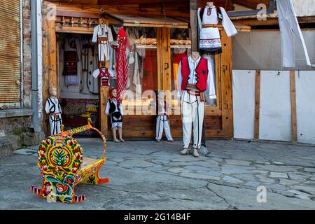 Shop selling national costumes of Kosovo on cobblestone street, in Gjakova, Kosovo. Stock Photo