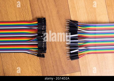 Set of multicolored wires on wooden background close up Stock Photo