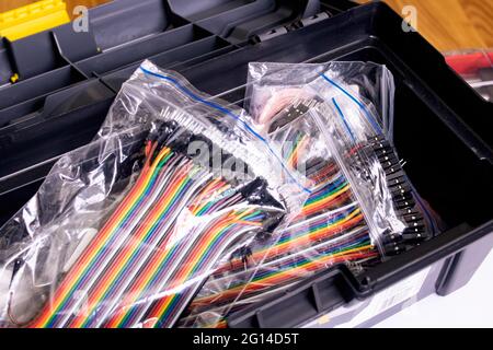 Colored wires in bags in a box close up Stock Photo