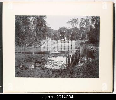 View of river with dredger mill at Laboe-Dalam, Sumatra (Diam dredging machine). Dredging work by the Deli Society at the Tobacco Company Loeboe-Dalam in Beneden-Langkat in the east coast of Sumatra. Part of the Sumatra Photo album by Paul and Lucie Sandel from 1900. Stock Photo