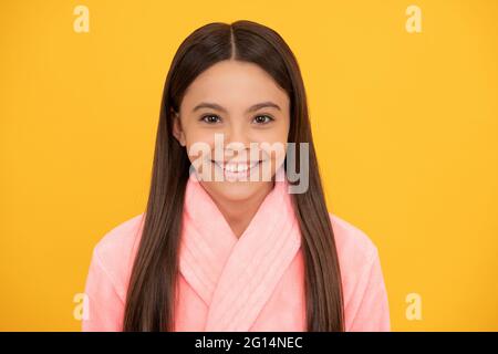 happy teen girl in home terry bathrobe, morning Stock Photo