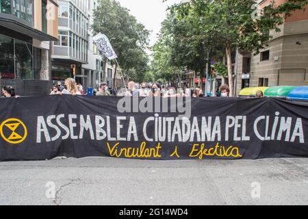 Protesters seen behind a banner that reads, Citizen Assembly for Climate, during the demonstration.The environmental activists of Extinction Rebellion of Barcelona, have demonstrated at the Ministry of Environment and Sustainable Development of Catalonia building to demand from the Minister of Climate Action, Food and Rural Agenda, Teresa Jorda, the commitment to create a Citizen Assembly for Climate in the Catalan areas. In the end, the agreement has been accepted by the Minister. (Photo by Thiago Prudencio/SOPA Images/Sipa USA) Stock Photo