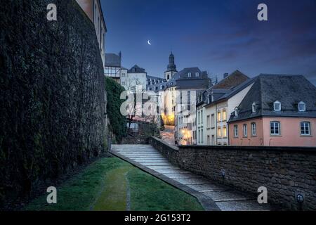 Luxembourg city street at night with St Michaels Church on background - Luxembourg City, Luxembourg Stock Photo