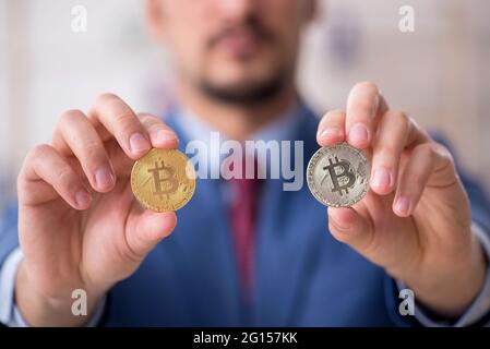 Man earning money via Internet in cryptocurrency concept Stock Photo