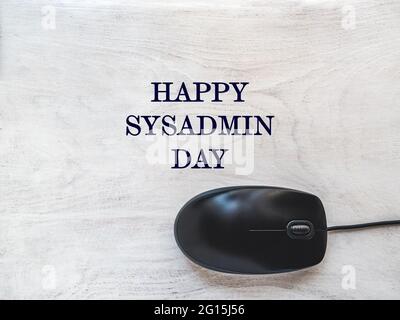 Happy Sysadmin Day. Beautiful greeting card. Close-up, view from above. Preparation for a professional holiday. Congratulations for family, relatives, Stock Photo