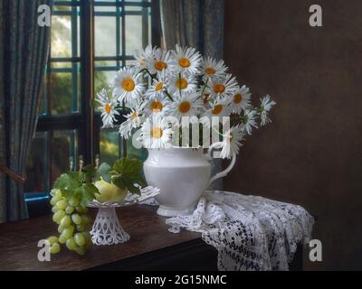 Still life with splendid bouquet and fruits in the interior Stock Photo ...