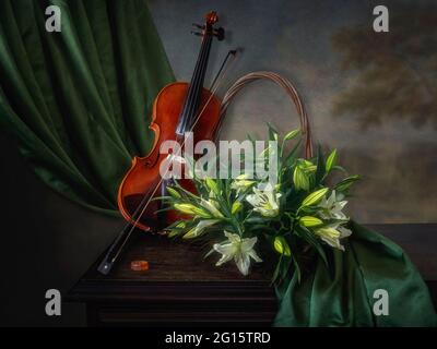 Still life with violin and bouquet of white lily Stock Photo