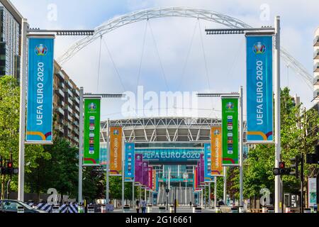 Wembley Stadium, Wembley Park, UK. 5th June 2021. Wembley continues its preparations for the UEFA European Football Championship with the flagpoles along Olympic Way changed to brightly coloured Euro 2020 banners.  The tournament starts in 6 days, 11th June 2021. It was postponed by a year as the Coronavirus pandemic hit worldwide in 2020.  Amanda Rose/Alamy Live News Stock Photo