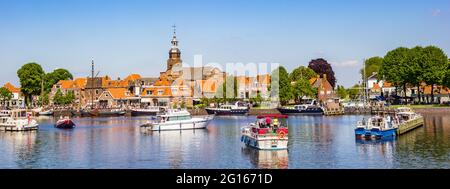 Panorama of historic village Blokzijl in summertime, with boats wating for the lock in the Netherlands Stock Photo
