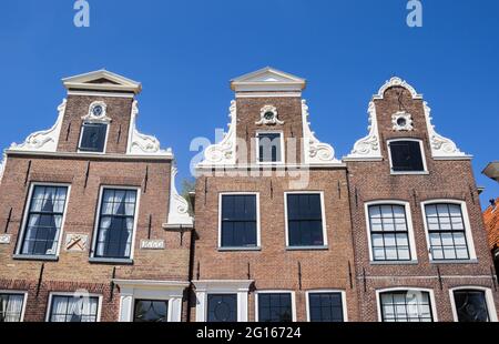 Front facades of historic houses in the harbor of Blokzijl, Netherlands Stock Photo