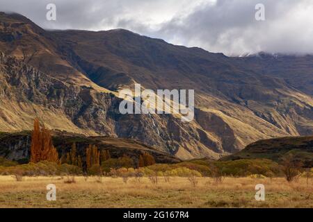 Mountains near Lake Wanaka in the South Island of New Zealand. The twin falls, a pair of waterfalls, can be seen at the center left Stock Photo