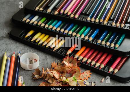 bright colored pencils on a gray background Stock Photo
