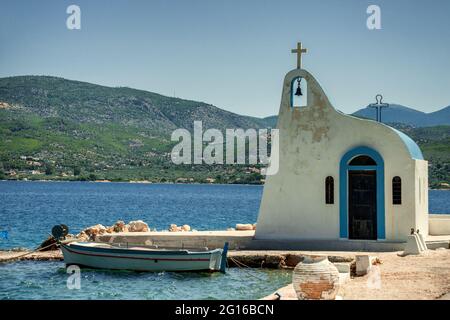 Typical Greek Chapel in Ypanema at Heraion (Vouliagmeni) lake in Greece Stock Photo