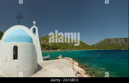 Typical Greek Chapel in Ypanema at Heraion (Vouliagmeni) lake in Greece Stock Photo