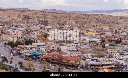 Göreme, Turkey - March 20, 2020 - beautiful panorama view of the town of Göreme in Cappadocia, Turkey with fairy chimneys, houses, and unique rock f Stock Photo