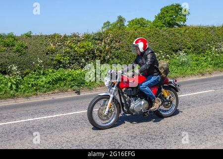 2018 Red Royal Enfield Continental Gt E4, 535cc per motorcycle Motorbike rider; two wheeled transport, motorcycles, vehicle, roads, motorbikes, motorcycle bike riders en-route to Capesthorne Hall classic May car show, Cheshire, UK Stock Photo