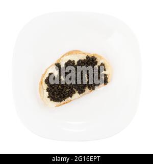 Real, not imitated, beluga caviar on plate, isolated on white Stock Photo