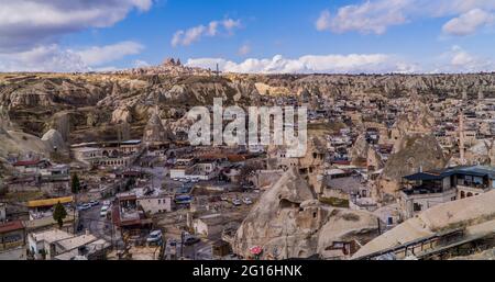 Göreme, Turkey - March 20, 2020 - beautiful panorama view of the town of Göreme in Cappadocia, Turkey with fairy chimneys, houses, and unique rock f Stock Photo