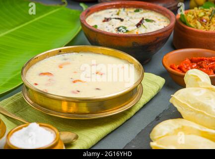 Kerala traditional feast side dishes arranged  in grey colour background Stock Photo