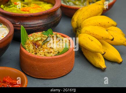 Kerala traditional feast side dishes arranged  in greycolour background Stock Photo