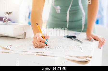 Tailor making pattern on cloth Stock Photo