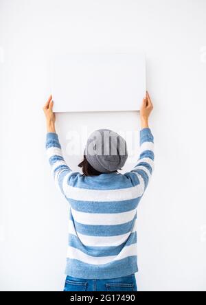 Girl holding blank canvas Stock Photo