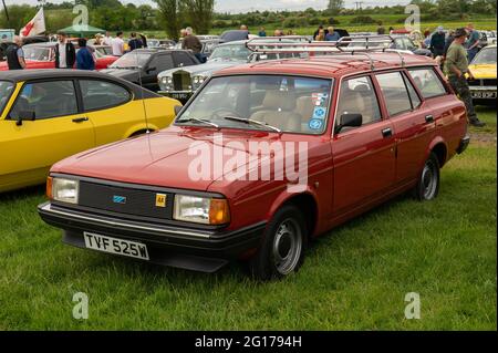 A dark red British leyland Ital estate with roof rack at a car rally Stock Photo