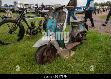 A very old  scooter in very poor condition possibly found in a barn Stock Photo