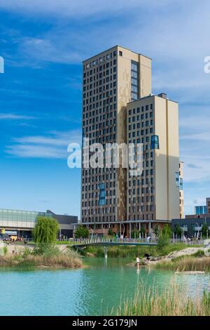 Wien, Vienna: 84 m high wooden skyscraper HoHo Holzhochhaus, tallest wooden skyscraper in the world, in new district Seestadt Aspern, pond Asperner Se Stock Photo